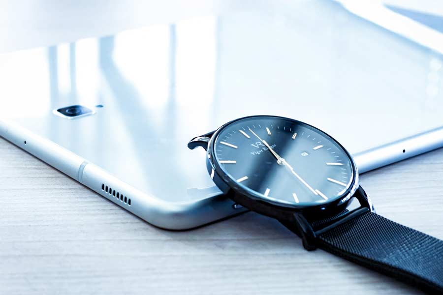 Close up photo of Phone and a Watch