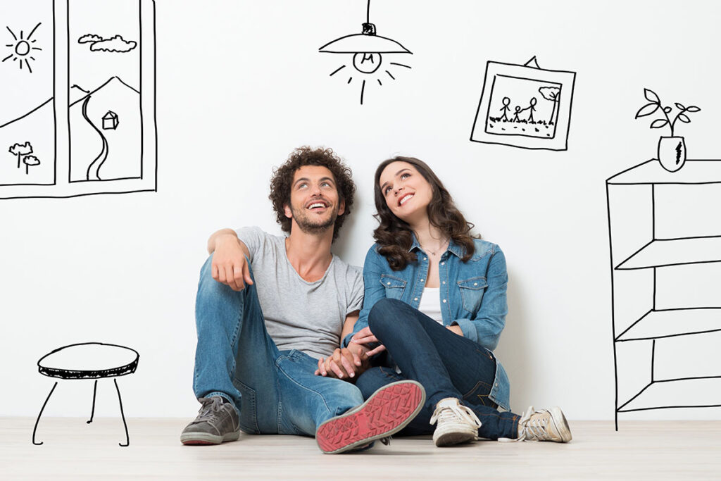A couple dreaming of protecting their new house with Kyle home insurance.